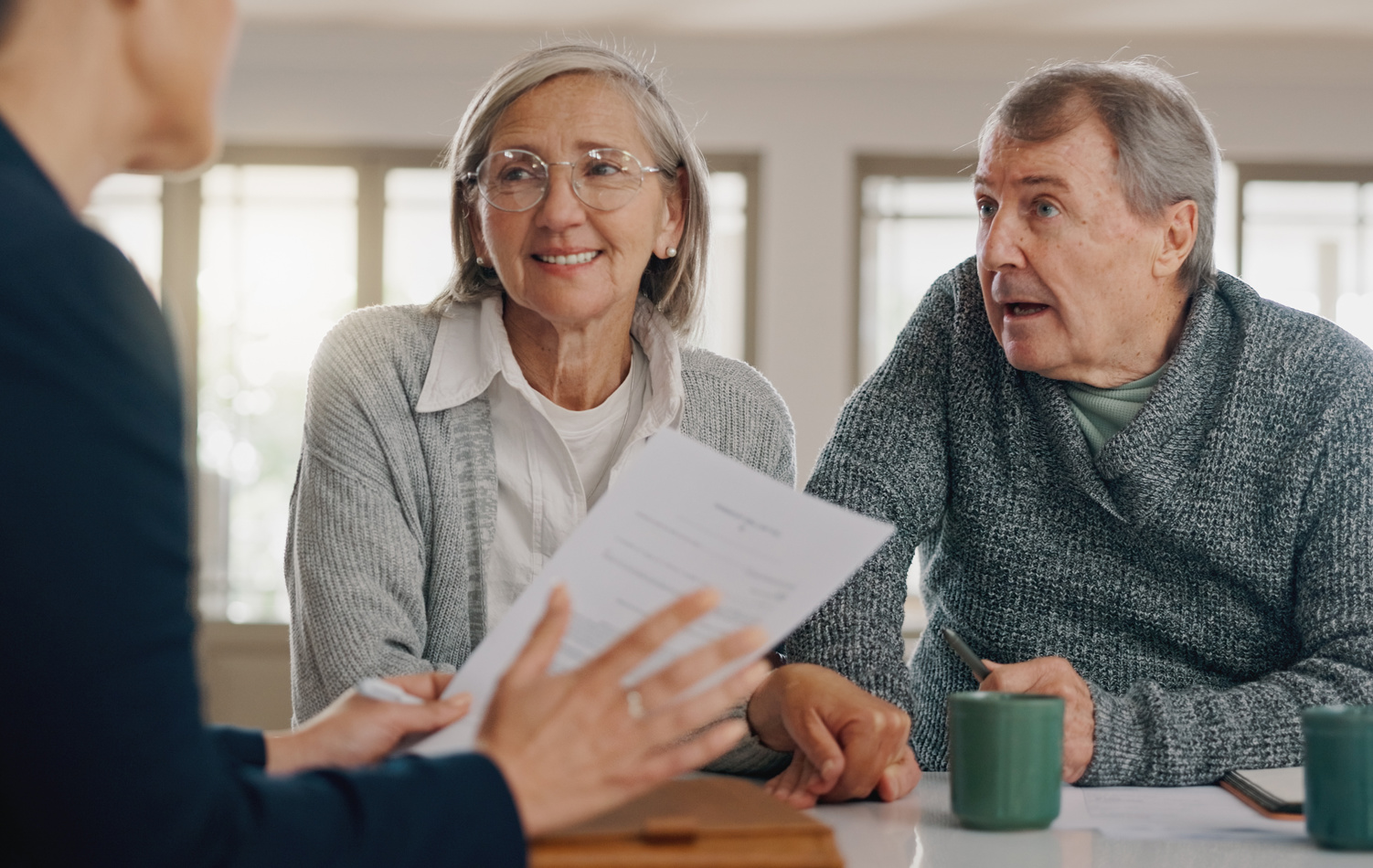 Retired Couple speaking to pension expert