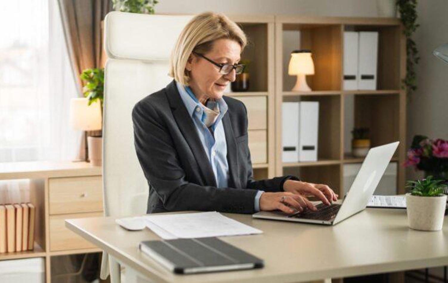 Woman Typing On Her Laptop
