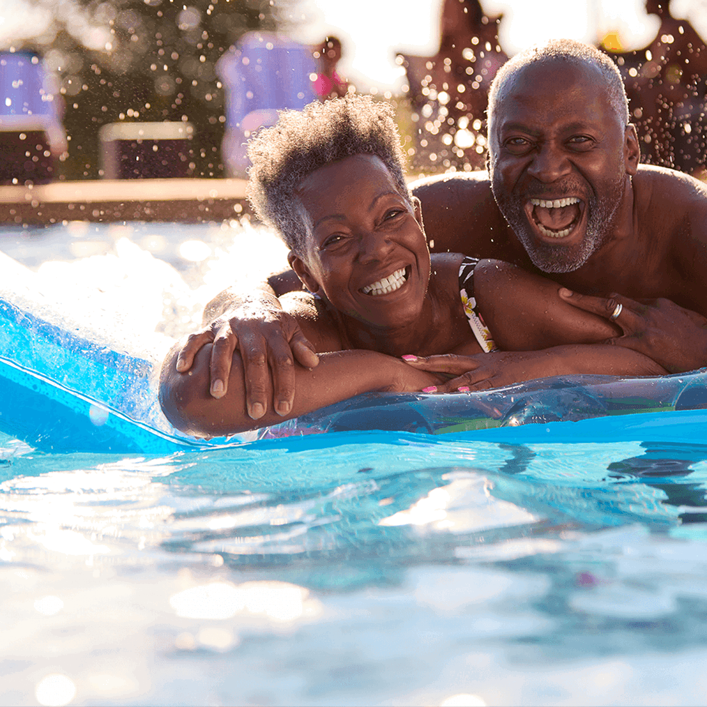 Couple enjoying retirement in the pool