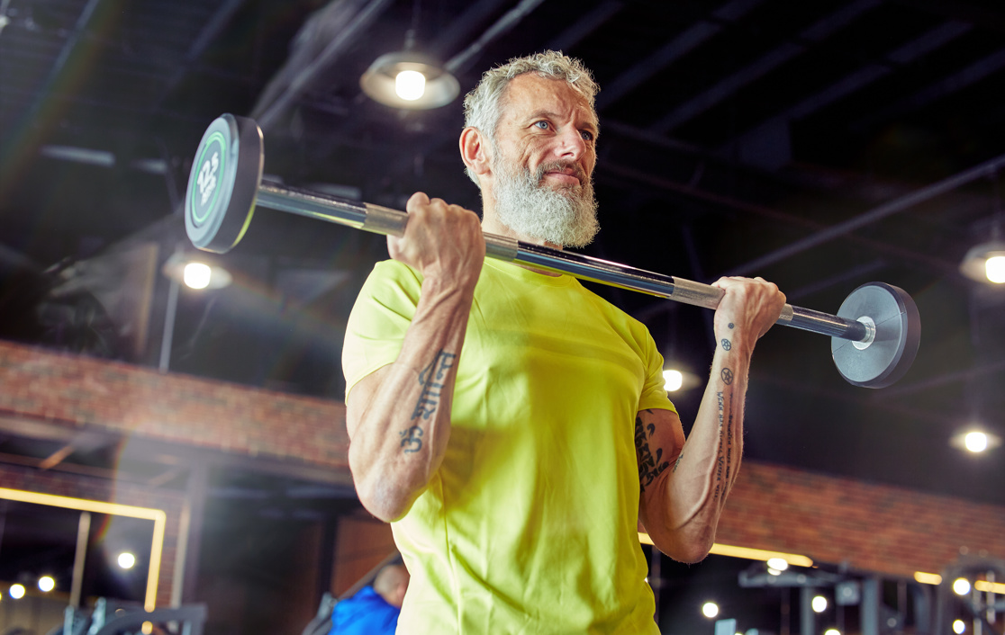 Older man lifting weights